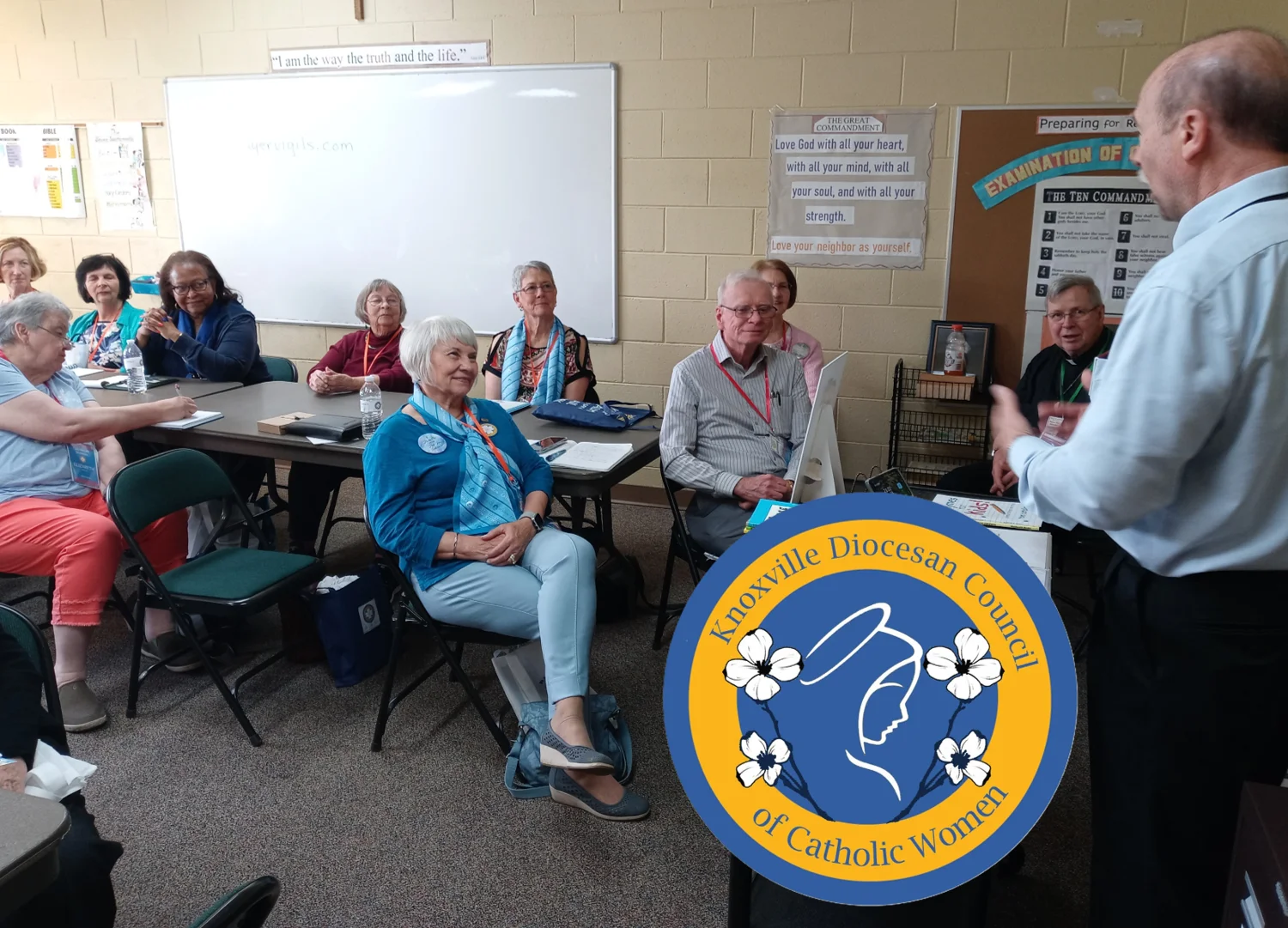 Tom Catalano speaking to a Catholic women's council group, with the Knoxville Diocesan Council of Catholic Women logo