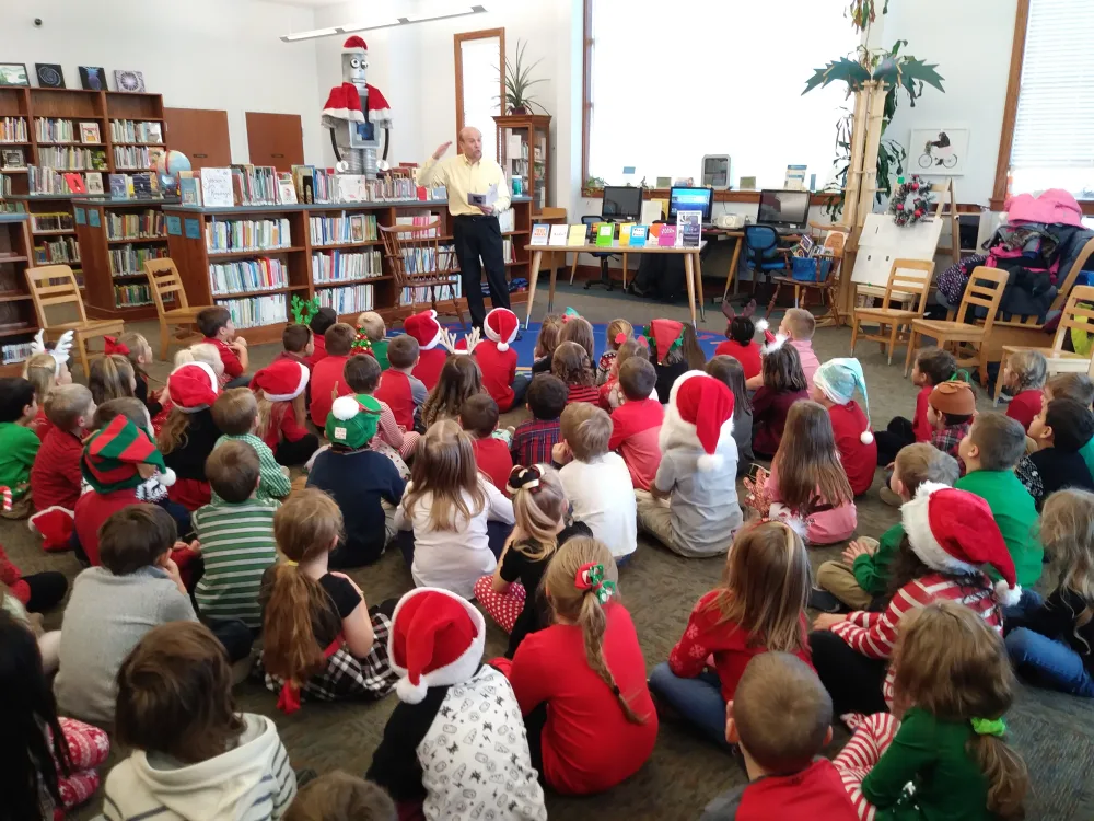 Tom Catalano reading to a school library group