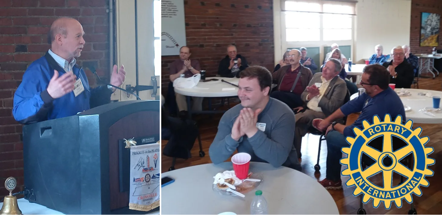 Tom Catalano speaking at a Rotary Club meeting, with the Rotary International logo